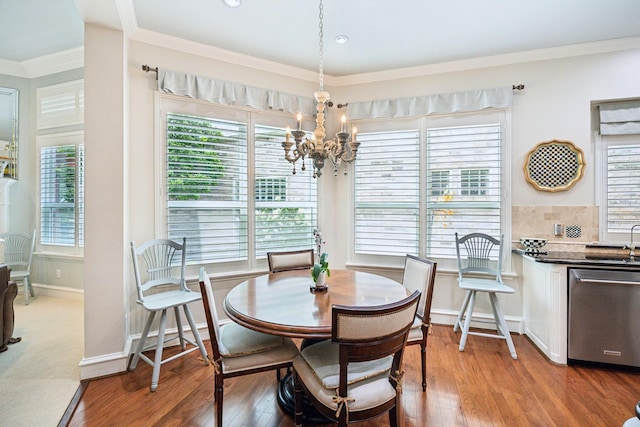 3024 Greenhill Dr, Plano, TX 75093 - dining room featuring a chandelier, plenty of natural light, light wood-type flooring, baseboards, and ornamental molding