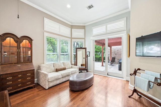 3024 Greenhill Dr, Plano, TX 75093 - living area featuring crown molding, wood finished floors, and a towering ceiling