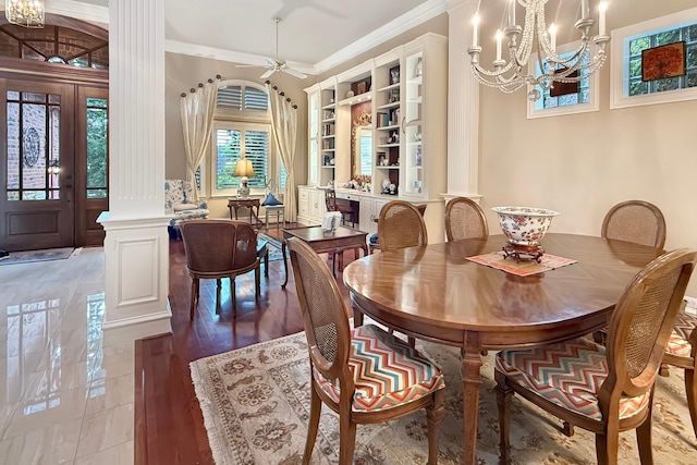 3024 Greenhill Dr, Plano, TX 75093 - dining room featuring ornate columns, a chandelier, ceiling fan, built in shelves, and crown molding