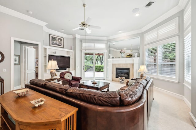 3024 Greenhill Dr, Plano, TX 75093 - living area with a glass covered fireplace, crown molding, healthy amount of natural light, a ceiling fan, and baseboards