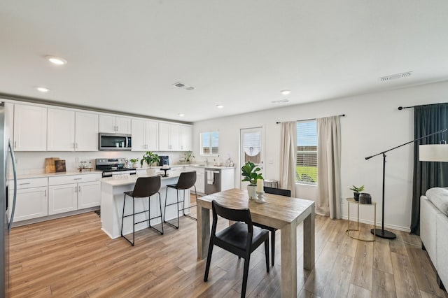 1229 Autumn Mist Ln, Forney, TX 75126 - dining space featuring recessed lighting and light wood-style floors