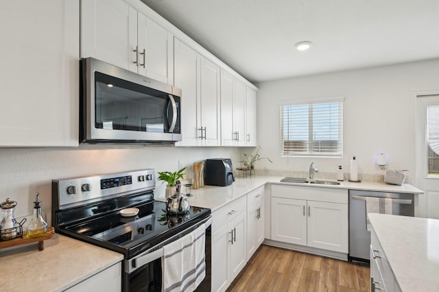 1229 Autumn Mist Ln, Forney, TX 75126 - kitchen featuring appliances with stainless steel finishes, a sink, and light countertops