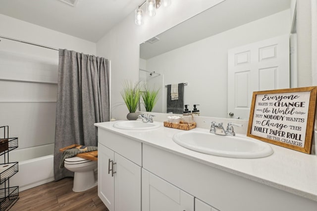 1229 Autumn Mist Ln, Forney, TX 75126 - full bath with toilet, wood finished floors, double vanity, and shower / washtub combination