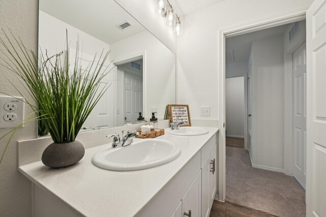 1229 Autumn Mist Ln, Forney, TX 75126 - full bathroom featuring double vanity and wood finished floors