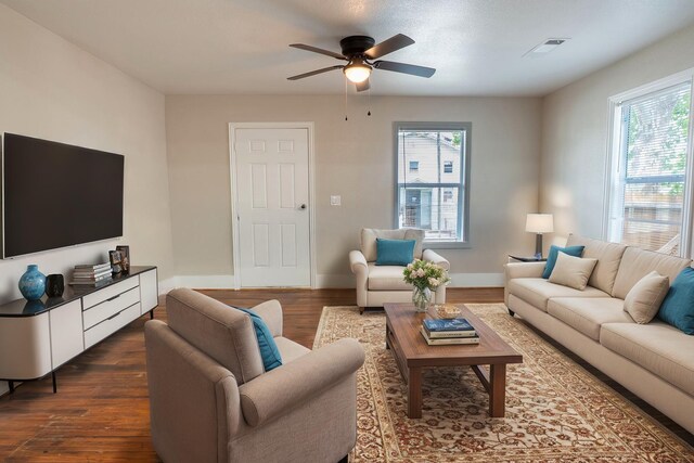 409 Forby Ave, Fort Worth, TX 76103 - living room featuring dark wood finished floors, a ceiling fan, and baseboards