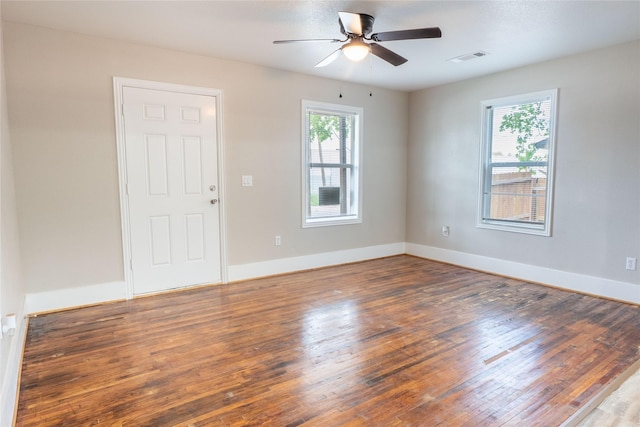 409 Forby Ave, Fort Worth, TX 76103 - spare room with wood finished floors, a ceiling fan, and baseboards