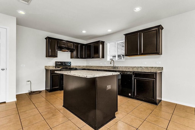 133 Feverbush Dr, Fate, TX 75189 - kitchen with black appliances, light tile patterned flooring, under cabinet range hood, a kitchen island, and baseboards