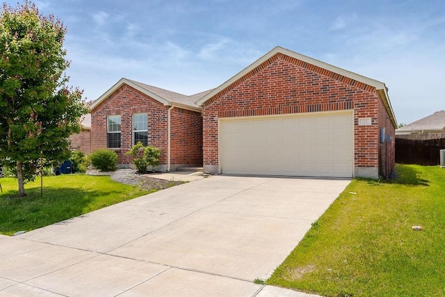 133 Feverbush Dr, Fate, TX 75189 - view of front of house with brick siding, concrete driveway, and an attached garage