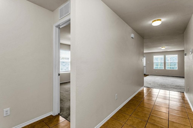 133 Feverbush Dr, Fate, TX 75189 - hall with carpet flooring, tile patterned flooring, and baseboards