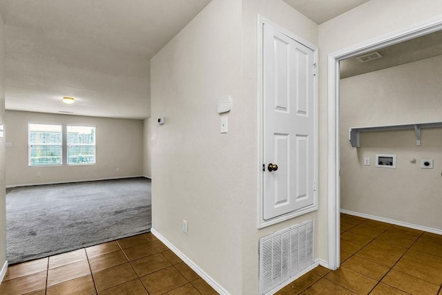 133 Feverbush Dr, Fate, TX 75189 - hall with tile patterned floors, carpet, and baseboards