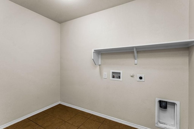 133 Feverbush Dr, Fate, TX 75189 - laundry room featuring baseboards, gas dryer hookup, hookup for a washing machine, hookup for an electric dryer, and dark tile patterned flooring