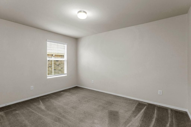 133 Feverbush Dr, Fate, TX 75189 - spare room featuring dark carpet and baseboards