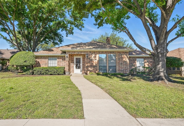 1027 Ridgeview Cir, Carrollton, TX 75007 - view of front of property featuring brick siding, a front yard, and a chimney