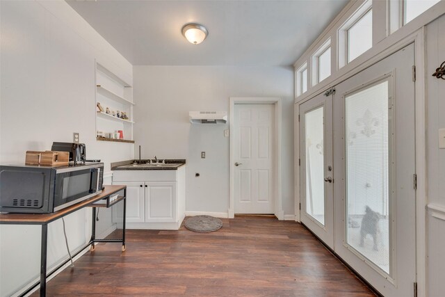 4732 Darla Dr, Fort Worth, TX 76132 - kitchen with dark wood finished floors, healthy amount of natural light, open shelves, and white cabinets