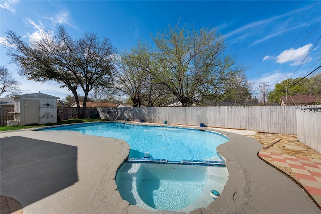 4732 Darla Dr, Fort Worth, TX 76132 - view of swimming pool featuring a fenced backyard, a storage unit, a pool with connected hot tub, an outdoor structure, and a patio