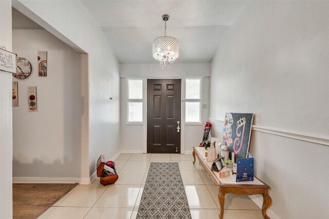 4732 Darla Dr, Fort Worth, TX 76132 - foyer with a chandelier, light tile patterned floors, and baseboards