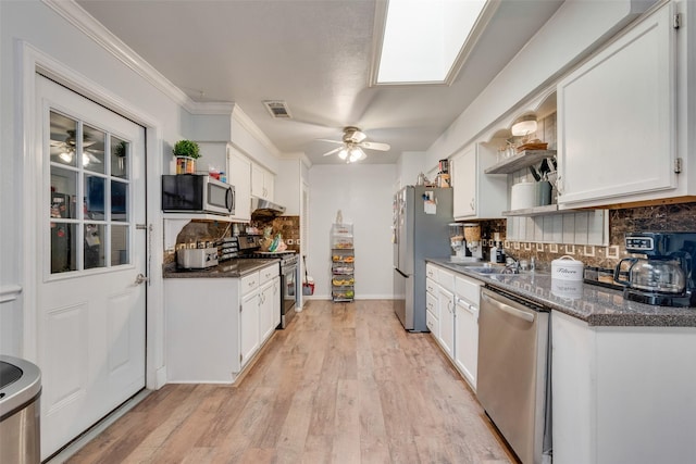 4732 Darla Dr, Fort Worth, TX 76132 - kitchen featuring stainless steel appliances, ceiling fan, open shelves, decorative backsplash, and ornamental molding