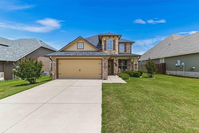 10805 Aurora Dr, Waco, TX 76708 - view of front of home with a garage, driveway, brick siding, a shingled roof, and stone siding