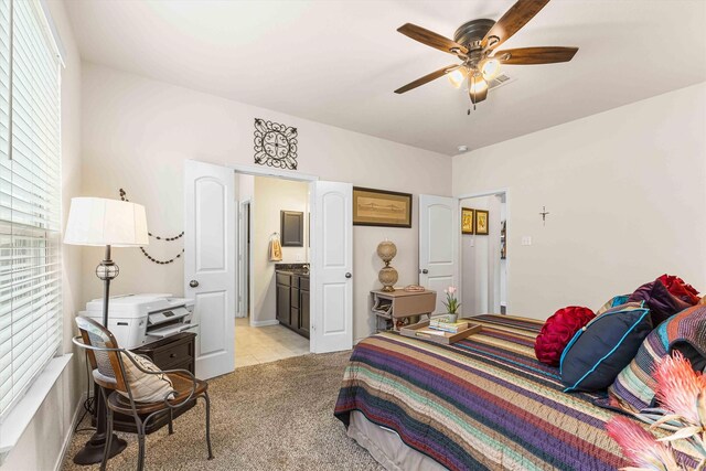 10805 Aurora Dr, Waco, TX 76708 - bedroom with light carpet, ensuite bath, and ceiling fan