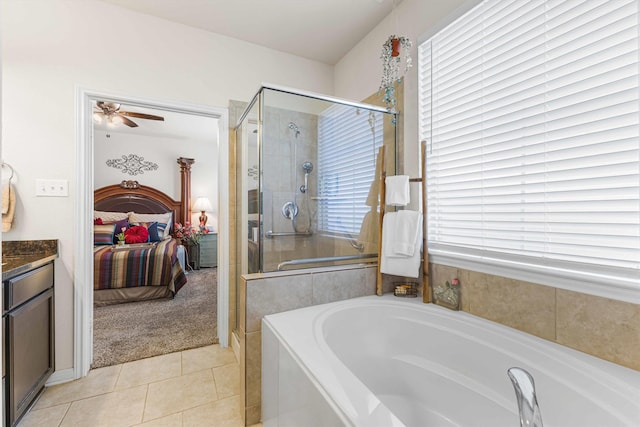 10805 Aurora Dr, Waco, TX 76708 - ensuite bathroom featuring a bath, a stall shower, tile patterned flooring, and plenty of natural light