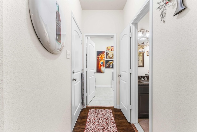 10805 Aurora Dr, Waco, TX 76708 - hall featuring dark wood finished floors and a textured wall
