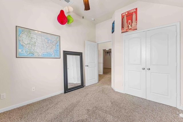 10805 Aurora Dr, Waco, TX 76708 - unfurnished bedroom featuring carpet, baseboards, a closet, and vaulted ceiling