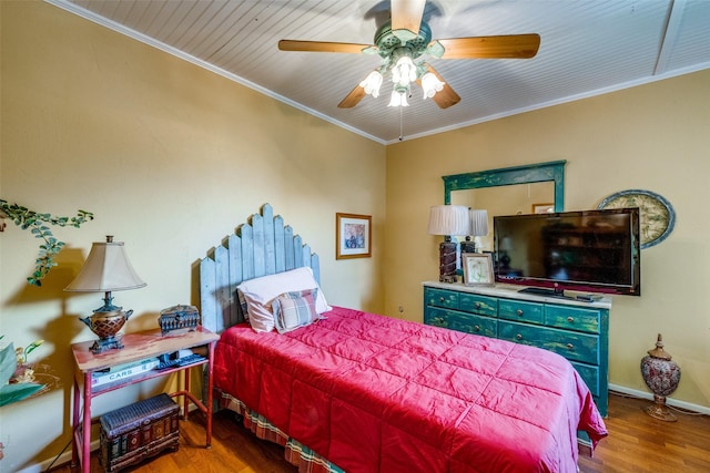 2043 Fleur De Lis Ct, Arlington, TX 76012 - bedroom featuring wood finished floors, crown molding, ceiling fan, and baseboards