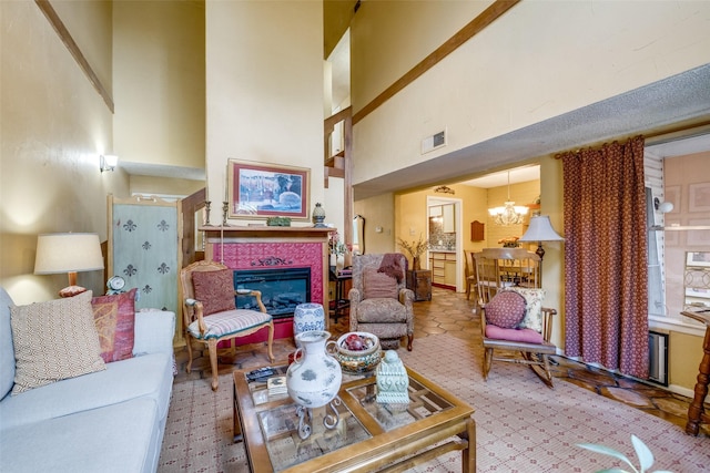 2043 Fleur De Lis Ct, Arlington, TX 76012 - living area with a towering ceiling, a chandelier, and a glass covered fireplace