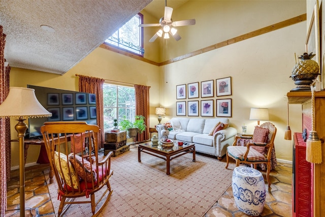 2043 Fleur De Lis Ct, Arlington, TX 76012 - living area featuring high vaulted ceiling, ceiling fan, a textured ceiling, and baseboards