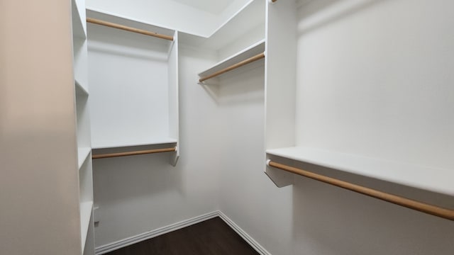 832 Adams Dr, Burleson, TX 76028 - spacious closet featuring dark wood-style floors