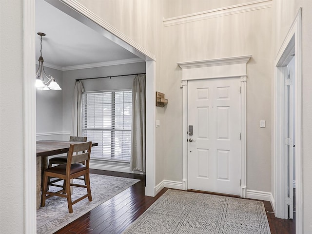 832 Adams Dr, Burleson, TX 76028 - foyer entrance featuring dark wood finished floors, baseboards, and crown molding