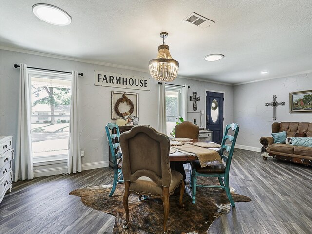 5433 Greenwood Way N, Richland Hills, TX 76180 - dining area featuring ornamental molding, plenty of natural light, dark wood-type flooring, baseboards, and a chandelier