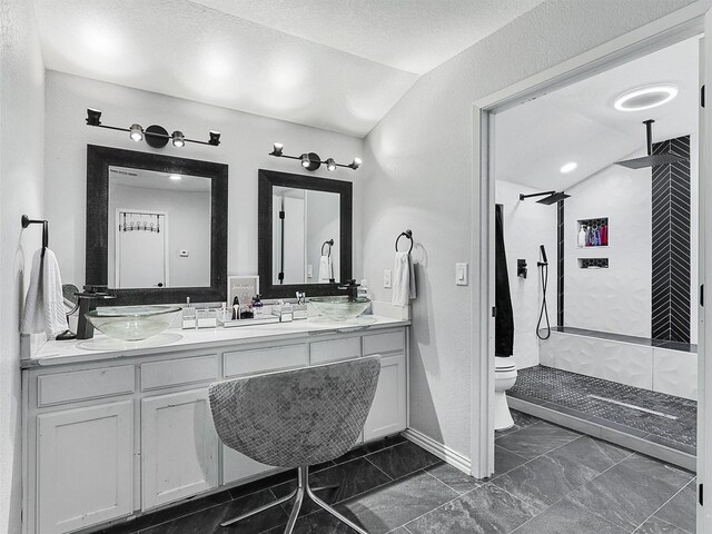 5433 Greenwood Way N, Richland Hills, TX 76180 - full bath with lofted ceiling, a tile shower, toilet, and marble finish floors