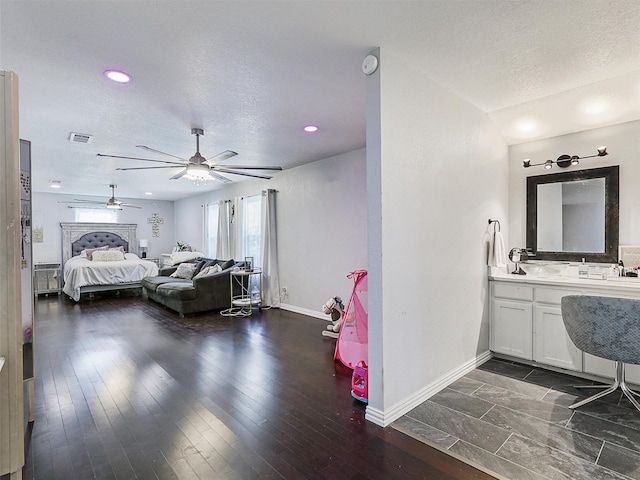 5433 Greenwood Way N, Richland Hills, TX 76180 - bedroom with multiple windows, baseboards, a textured ceiling, recessed lighting, and ceiling fan