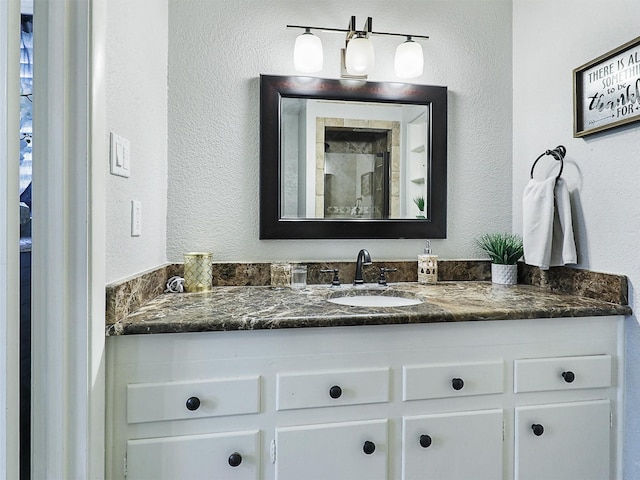 5433 Greenwood Way N, Richland Hills, TX 76180 - bathroom with vanity and a textured wall