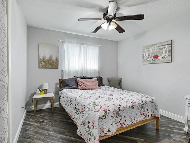 5433 Greenwood Way N, Richland Hills, TX 76180 - bedroom with baseboards, dark wood-style floors, and a ceiling fan