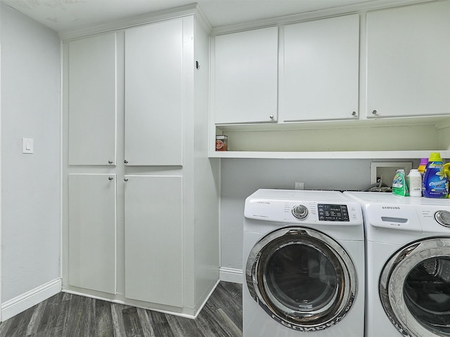 5433 Greenwood Way N, Richland Hills, TX 76180 - laundry area with washer and clothes dryer, baseboards, dark wood finished floors, and cabinet space