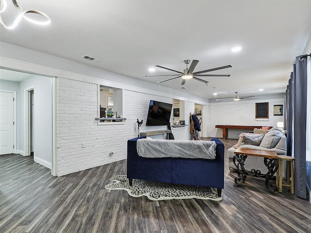 5433 Greenwood Way N, Richland Hills, TX 76180 - living area featuring brick wall, wood finished floors, baseboards, a ceiling fan, and recessed lighting