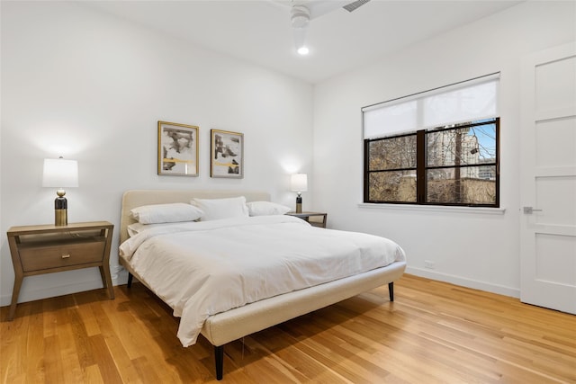 3723 Gilbert Ave, Dallas, TX 75219 - bedroom with baseboards and light wood-style flooring