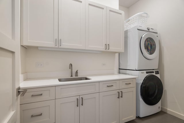 3723 Gilbert Ave, Dallas, TX 75219 - washroom with stacked washing machine and dryer, cabinet space, and baseboards