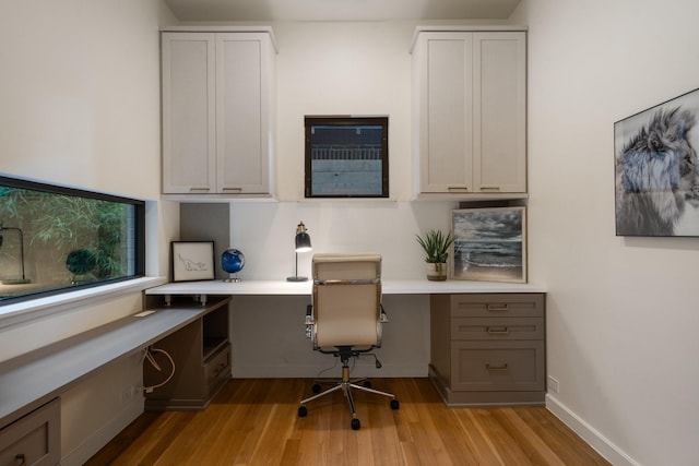 3723 Gilbert Ave, Dallas, TX 75219 - office space featuring built in desk, light wood finished floors, and baseboards
