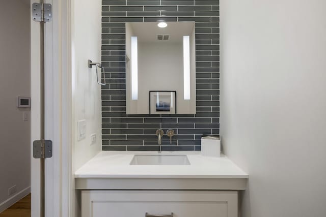 3723 Gilbert Ave, Dallas, TX 75219 - bathroom featuring tasteful backsplash and vanity