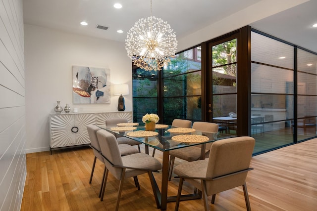 3723 Gilbert Ave, Dallas, TX 75219 - dining room featuring wood finished floors, a chandelier, recessed lighting, and baseboards