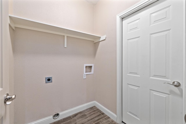 3004 Waterstone Way, Brownwood, TX 76801 - washroom with electric dryer hookup, washer hookup, baseboards, and dark wood-style flooring