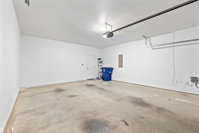 3004 Waterstone Way, Brownwood, TX 76801 - garage with a garage door opener, electric panel, and baseboards