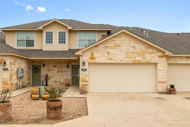 3004 Waterstone Way, Brownwood, TX 76801 - townhome / multi-family property featuring stone siding, a shingled roof, concrete driveway, and a garage