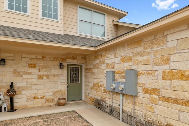 3004 Waterstone Way, Brownwood, TX 76801 - property entrance with stone siding and roof with shingles