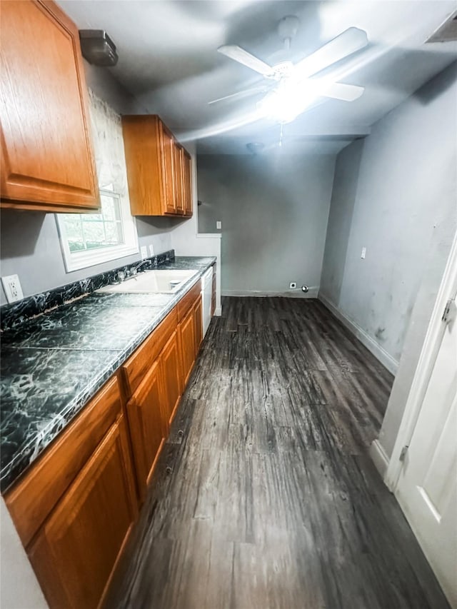 1706 N Ricketts St, Sherman, TX 75092 - kitchen with a sink, dark wood-style flooring, white dishwasher, ceiling fan, and brown cabinets