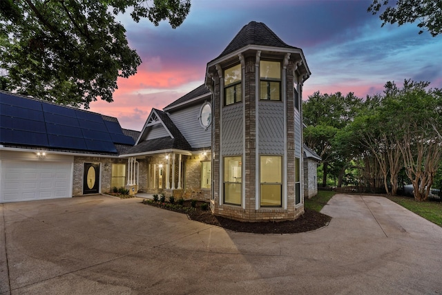 1110 Old Dominion Pl, Mansfield, TX 76063 - victorian home with driveway, solar panels, an attached garage, and brick siding