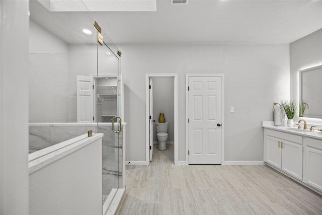 1110 Old Dominion Pl, Mansfield, TX 76063 - bathroom with a shower stall, a skylight, vanity, and toilet